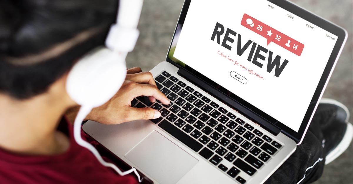 man looking at online review website